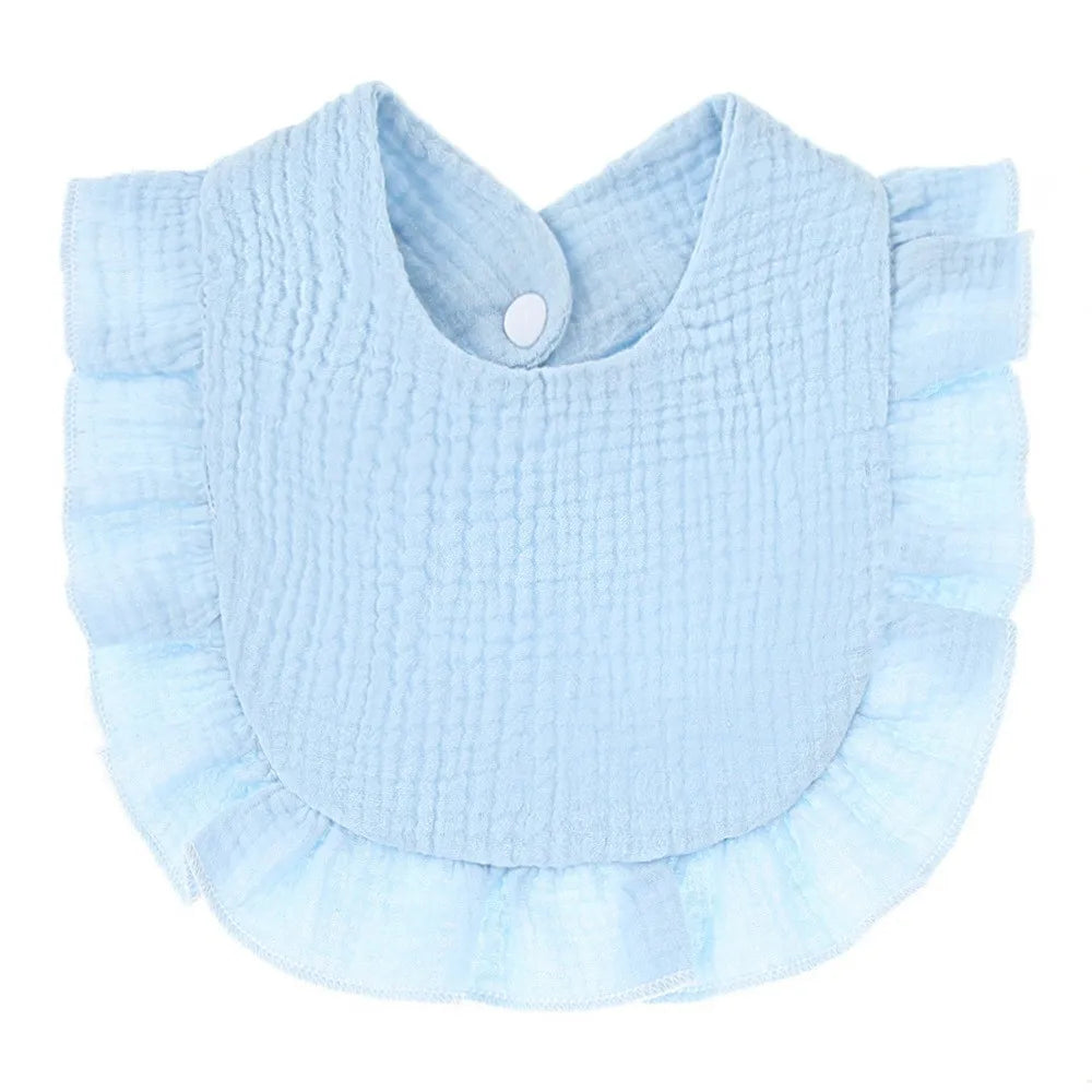 Light blue soft cotton baby bib in a bandana style with ruffled edges and a button closure