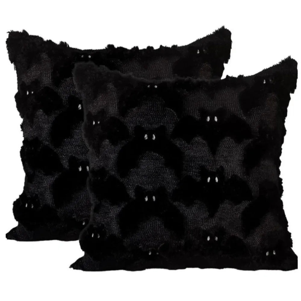 Black throw pillow cover featuring a pattern of small white Halloween ghosts and pumpkins.