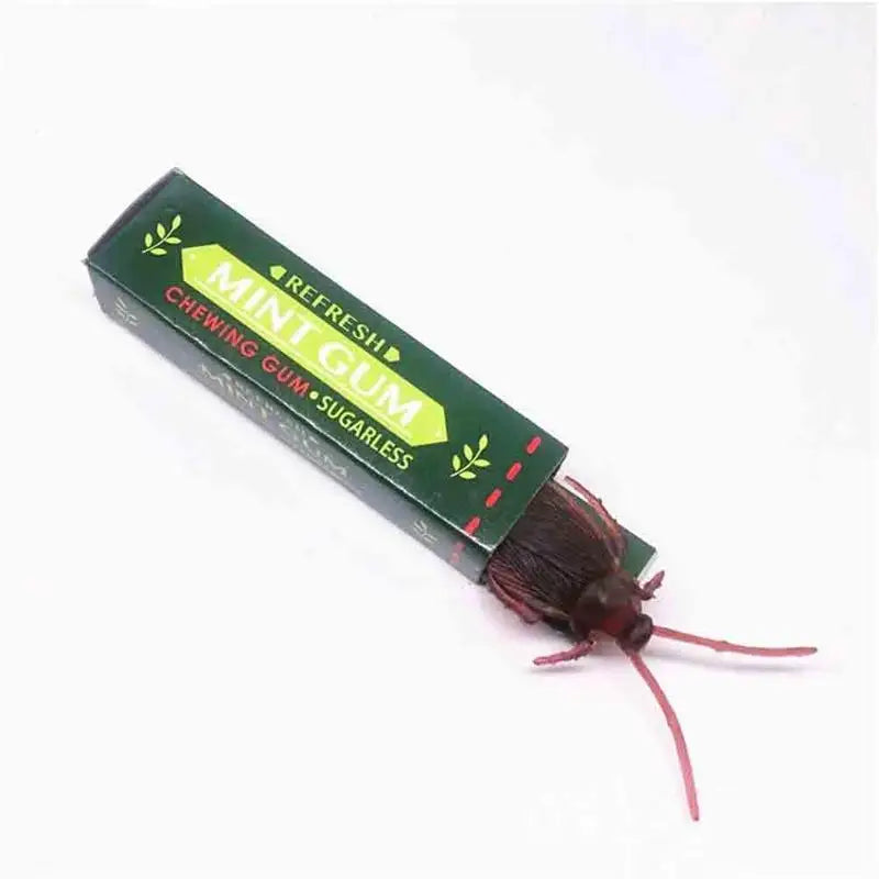 A package of mint gum with a cockroach-themed design and a dark brown stick.