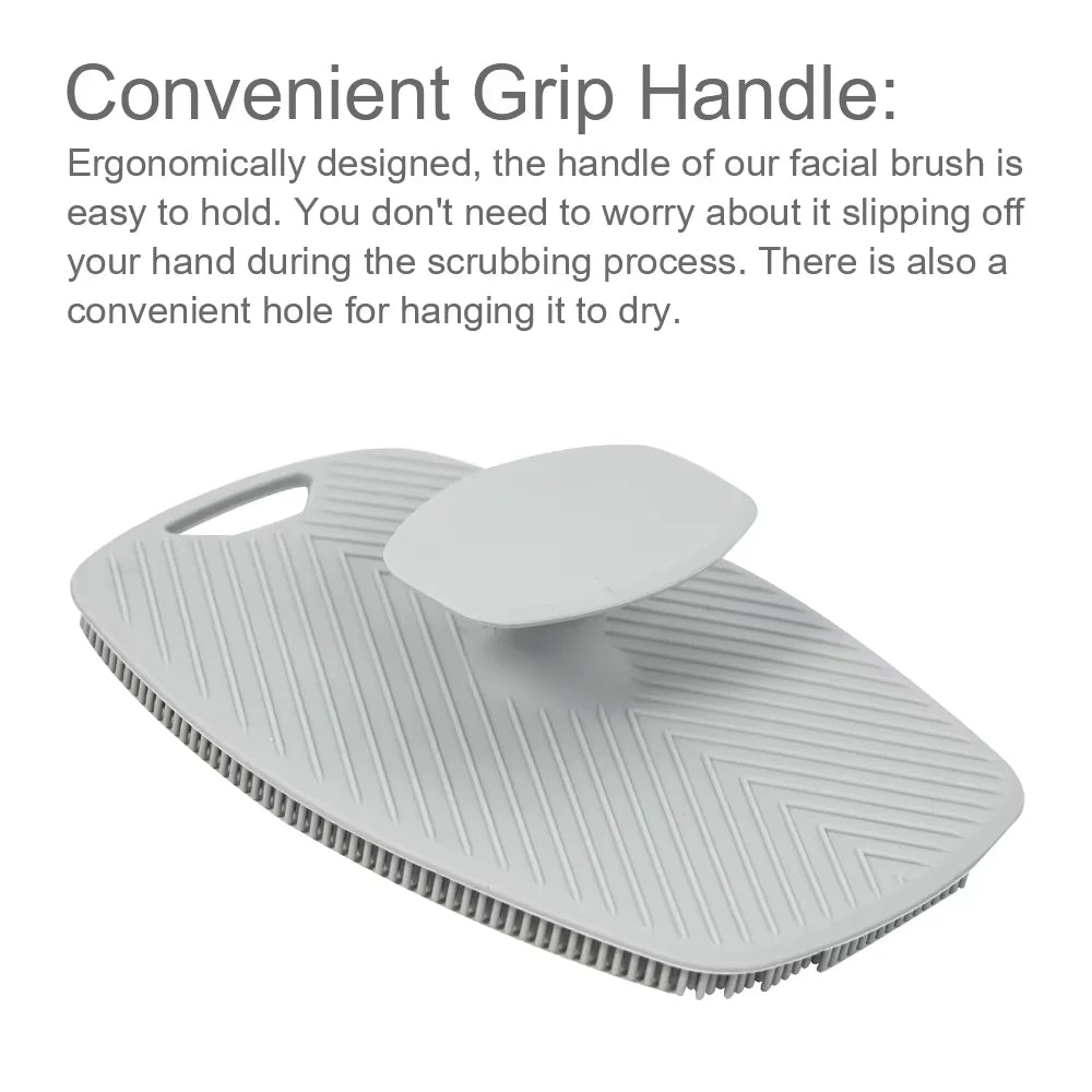 A white silicone body scrubber and massage brush with a convenient grip handle.