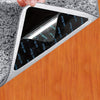 A close-up of reusable non-slip rug grippers designed to secure rugs on hardwood floors and tiles.