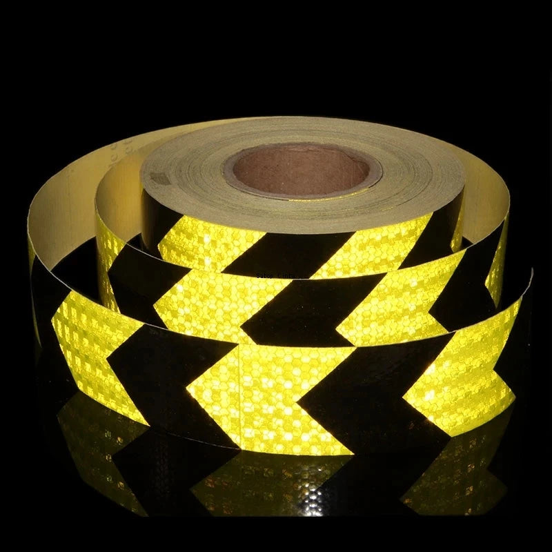 Roll of high-visibility reflective tape featuring a yellow and black honeycomb pattern.