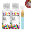 A bottle of Jigsaw Puzzle Glue with a sponge head and a brush applicator for diamond painting
