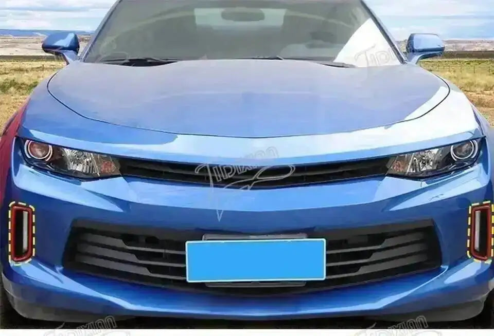 Front view of a blue Chevrolet Camaro with an interior and exterior trim kit installed.