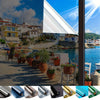 Rolls of frosted privacy window film in various colors including blue, silver, black, and gold.