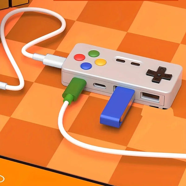 A beige 4-in-1 USB hub with dual Type-C and USB ports connected by white cables on an orange checkered surface.
