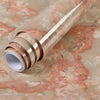 Roll of waterproof self-adhesive marble wallpaper in a beige and pink marbled pattern