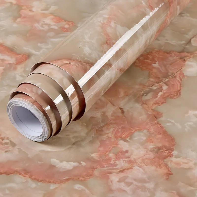 Roll of waterproof self-adhesive marble wallpaper in a beige and pink marbled pattern