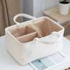 A white, fluffy portable diaper bag organizer with a lid and divided compartments for storing bottles or items.
