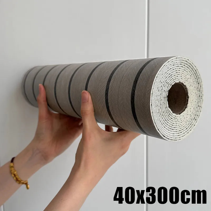 Roll of self-adhesive wood grain wall panels in gray and black for accent walls