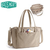 A beige structured laptop tote bag with convertible straps shown next to a logo.
