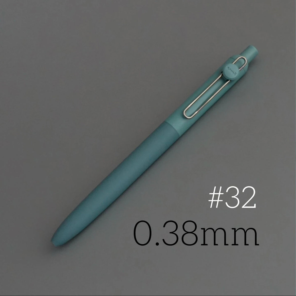A teal Uni ZENTO quick-dry gel pen shown diagonally against a gray background, with the size marked as 0.38mm.