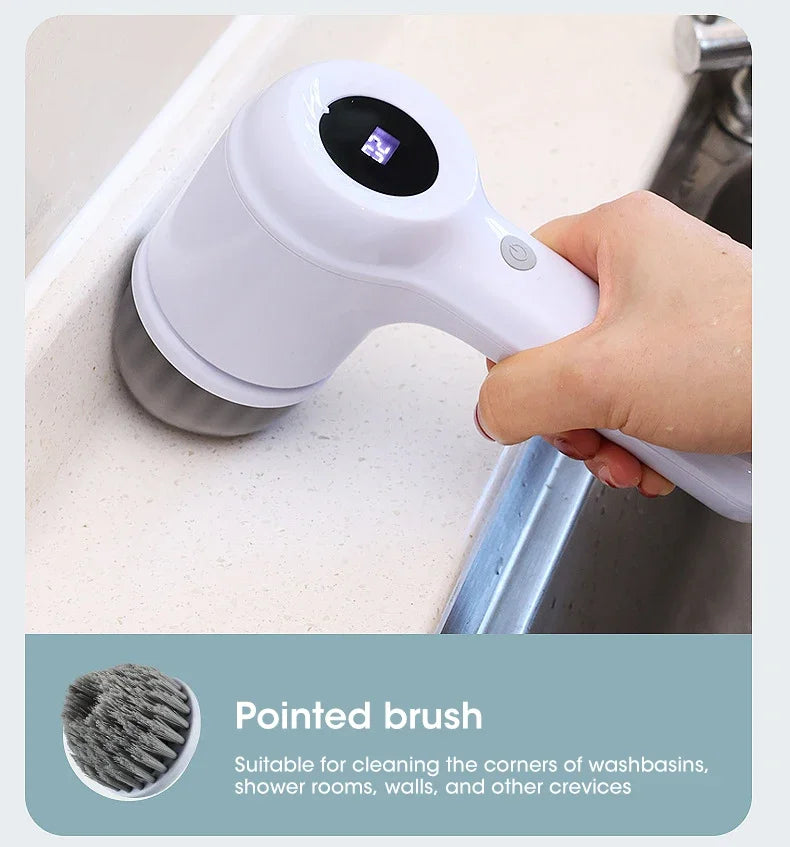 A hand is using a white pointed brush on a drain or washbasin to clean corners and crevices.