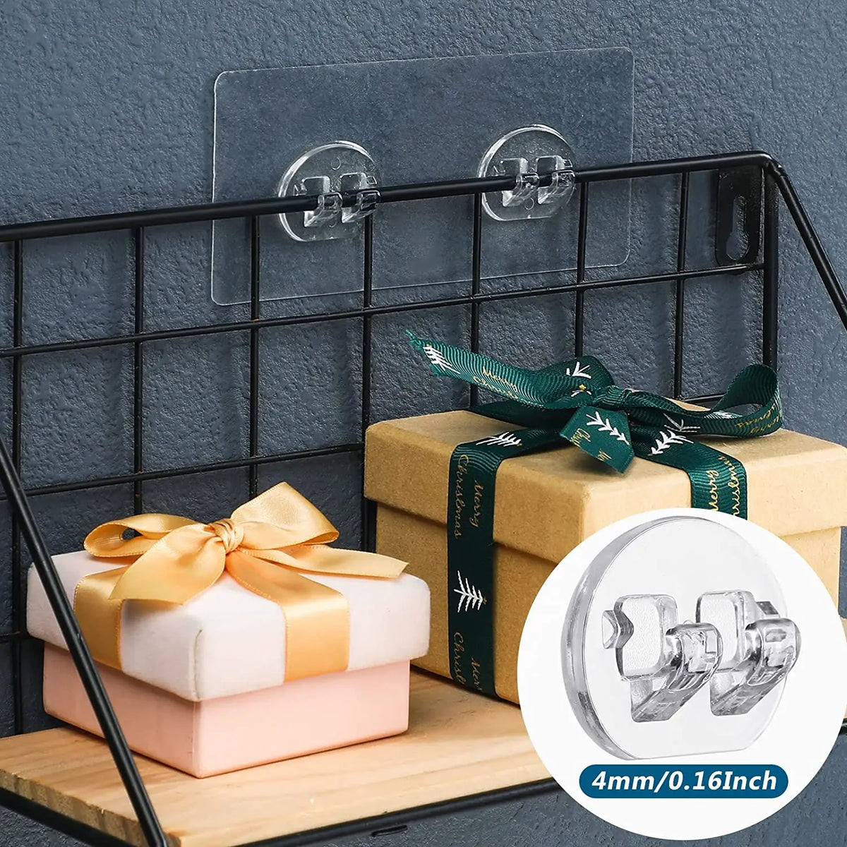 A set of no-drill adhesive hooks is displayed on a shelf with wrapped gifts and a black metal rack.