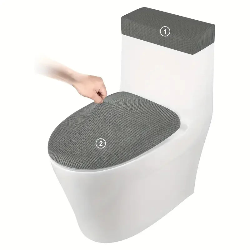 A white toilet seat with a gray fleece cover and lid, showing two numbered points on the seat.
