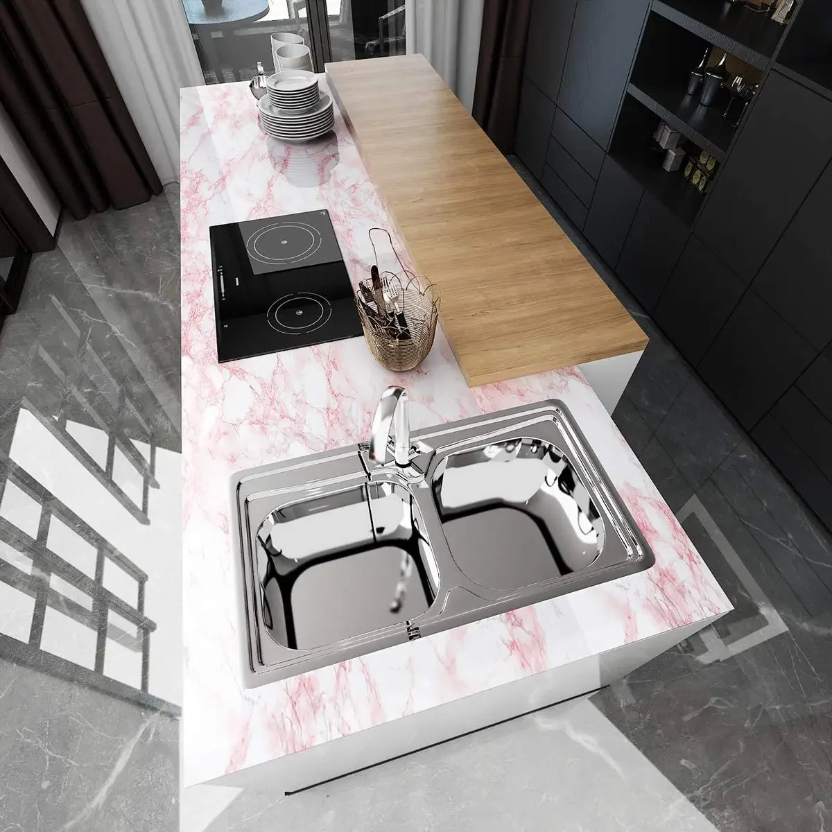 A kitchen counter featuring a stainless steel double sink and a wooden cutting board on a pink marble surface.