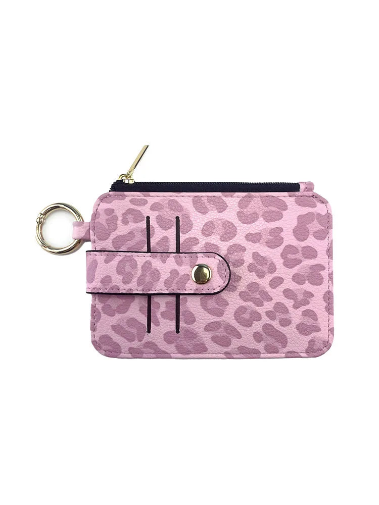 A pink leopard print PU leather card holder with a coin pocket and keychain.