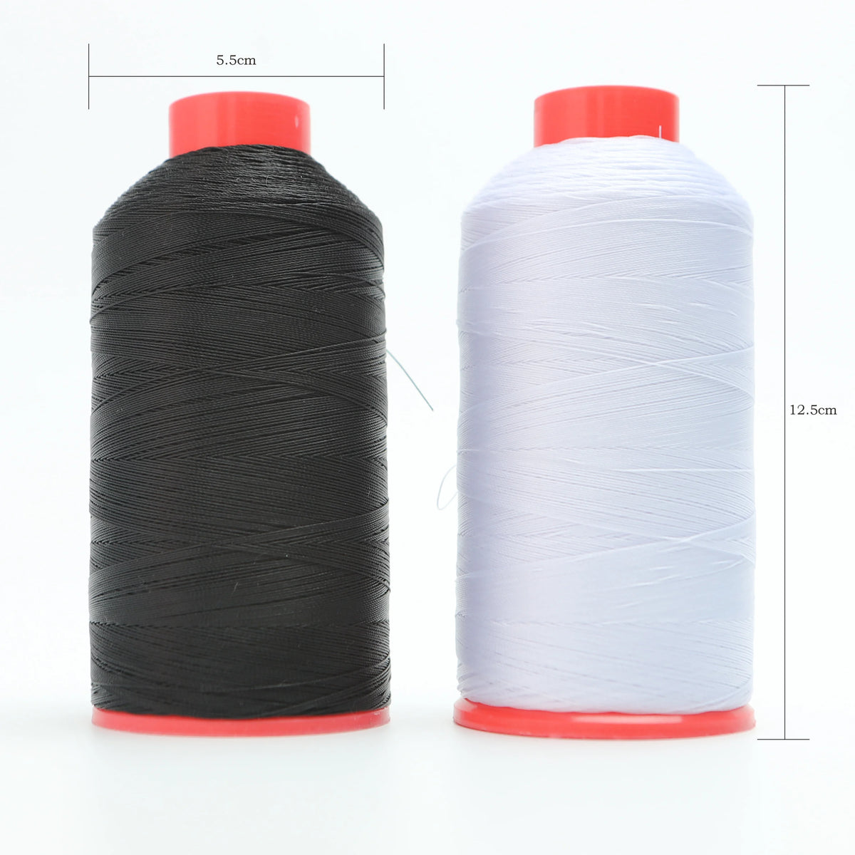 A spool of black heavy-duty nylon bonded thread with a red base, next to a spool of white thread.
