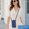 A woman models a light beige knit top and white pants while carrying a navy blue compact PU leather crossbody bag.