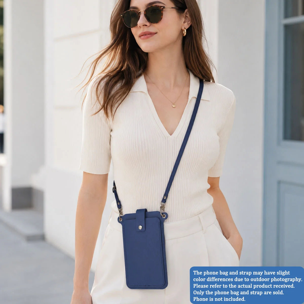 A woman models a light beige knit top and white pants while carrying a navy blue compact PU leather crossbody bag.