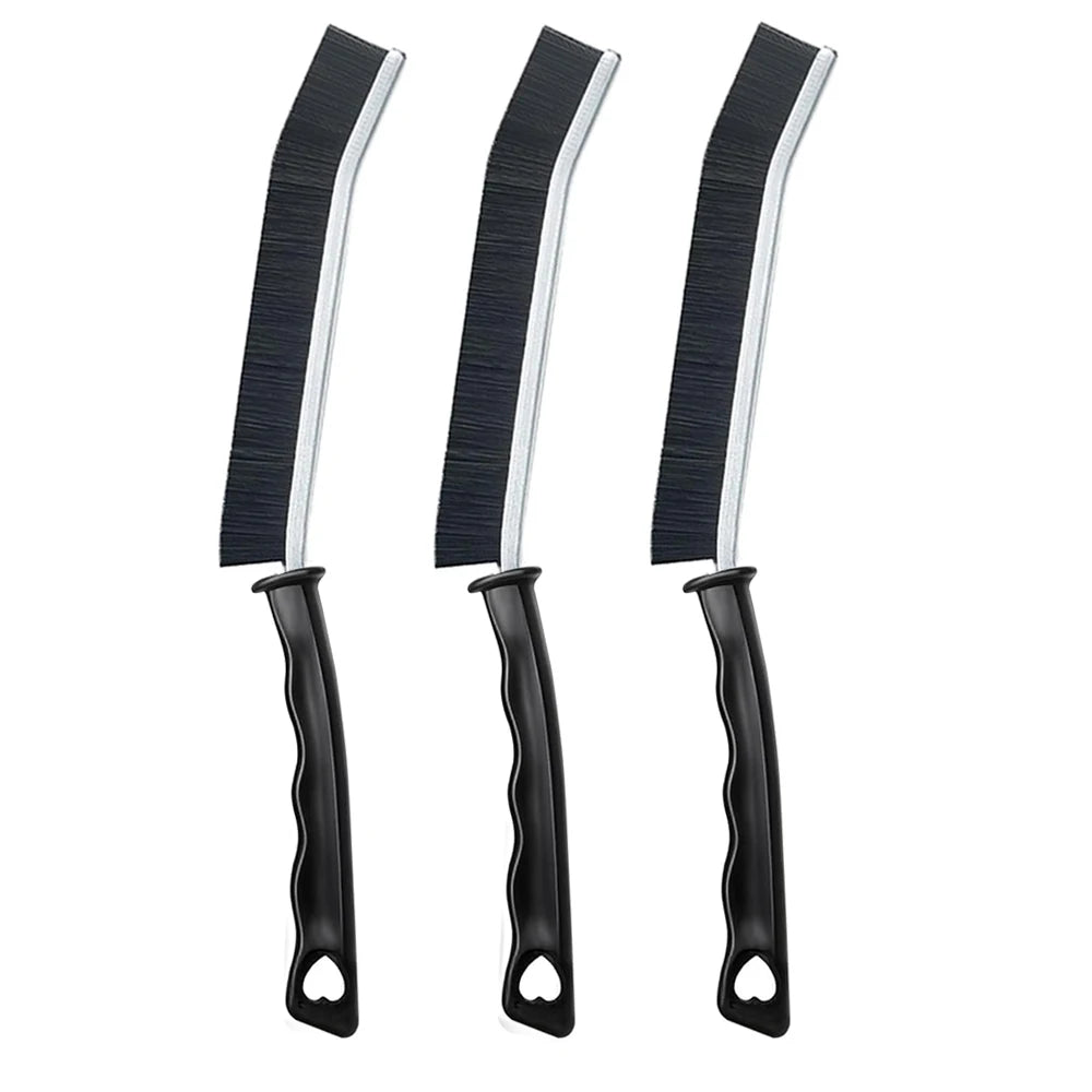 Three black and silver crevice cleaning brushes shown vertically