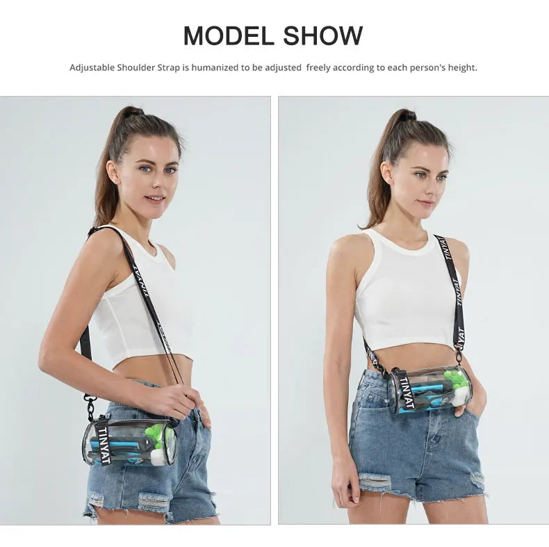 A woman models a clear stadium-approved crossbody bag with an adjustable strap worn over a white top and denim shorts.
