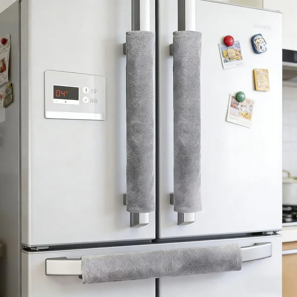 A white refrigerator with two gray oil-proof handle covers installed on the doors.