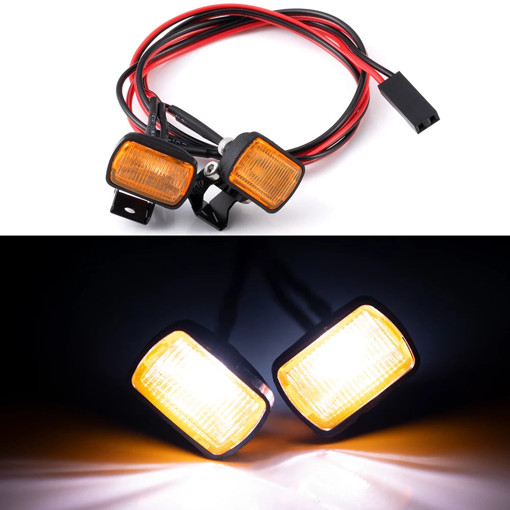An LED headlight and spotlight set with a red and black wire harness for RC crawler trucks.