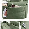 A quilted olive green puffy tote bag showing various exterior pockets and a laptop sleeve detail.