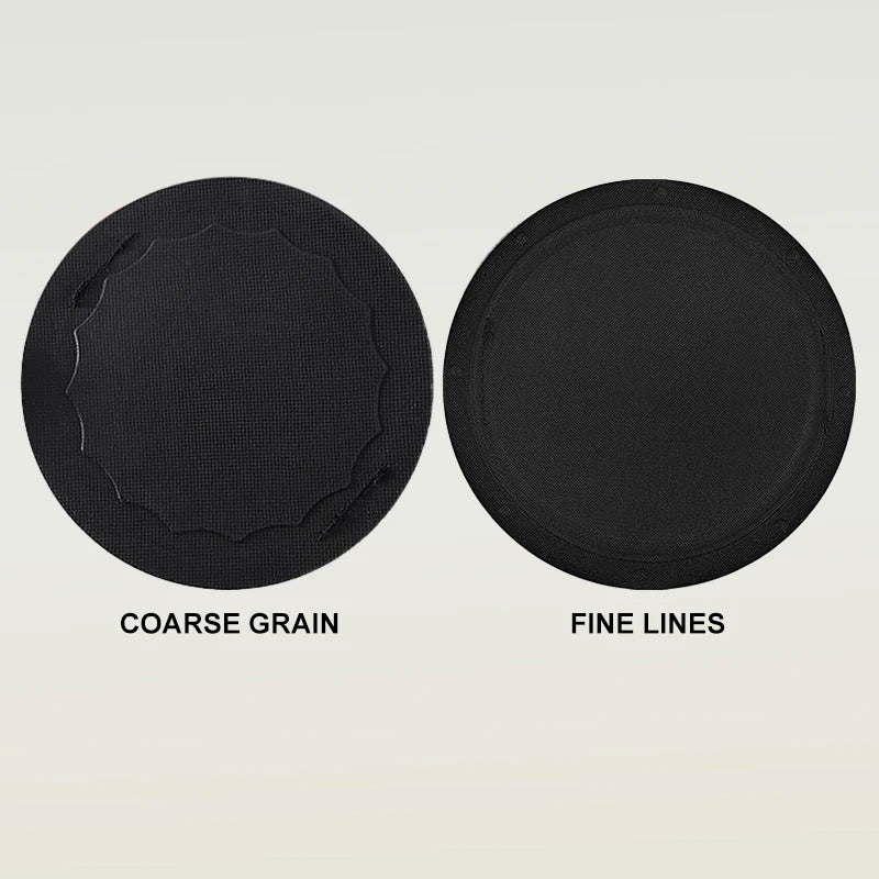 Two black exfoliating body scrub gloves showing coarse grain and fine lines textures.