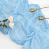 Light blue sheer cotton gauze table runner with white roses and gold accents