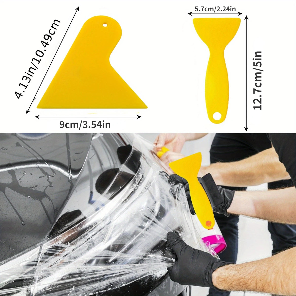 A hand is using a yellow squeegee tool to apply window tint film to a car window.