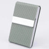 A slim card holder with a textured sage green fabric cover and a white card slot.