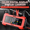 A red digital battery charger with an LCD display is shown installed in a car engine bay.