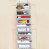 A gray 5-shelf over-the-door hanging storage organizer filled with various stuffed animals and small items.