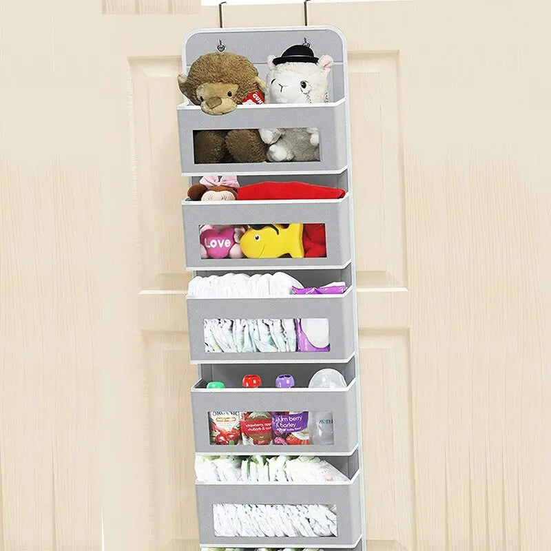 A gray 5-shelf over-the-door hanging storage organizer filled with various stuffed animals and small items.