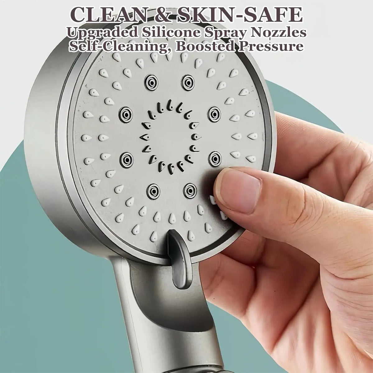 A hand holds a silver handheld shower head with upgraded silicone spray nozzles for self-cleaning and boosted pressure.