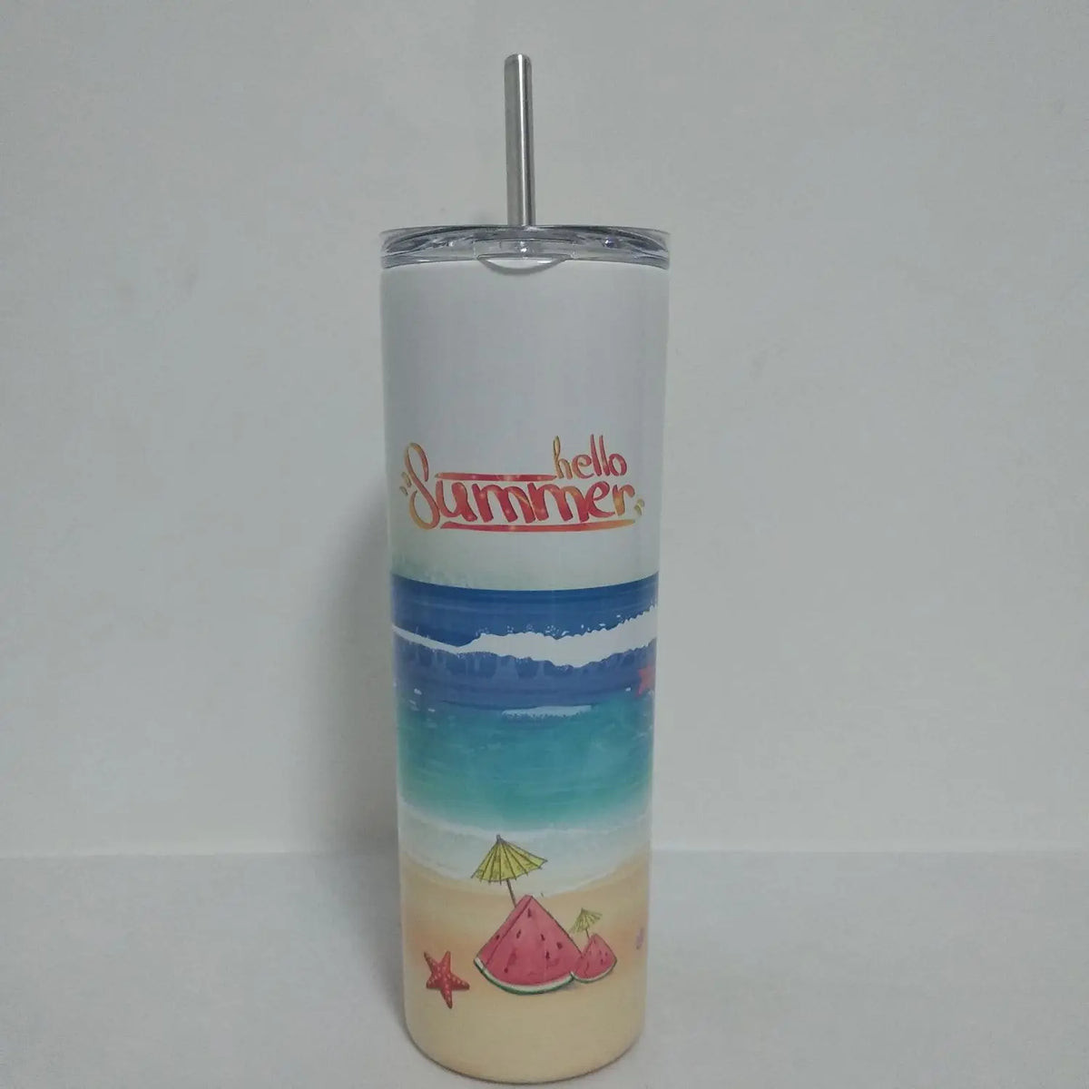 A tall tumbler with a summer theme featuring blue water, a sunset, and a watermelon slice illustration.