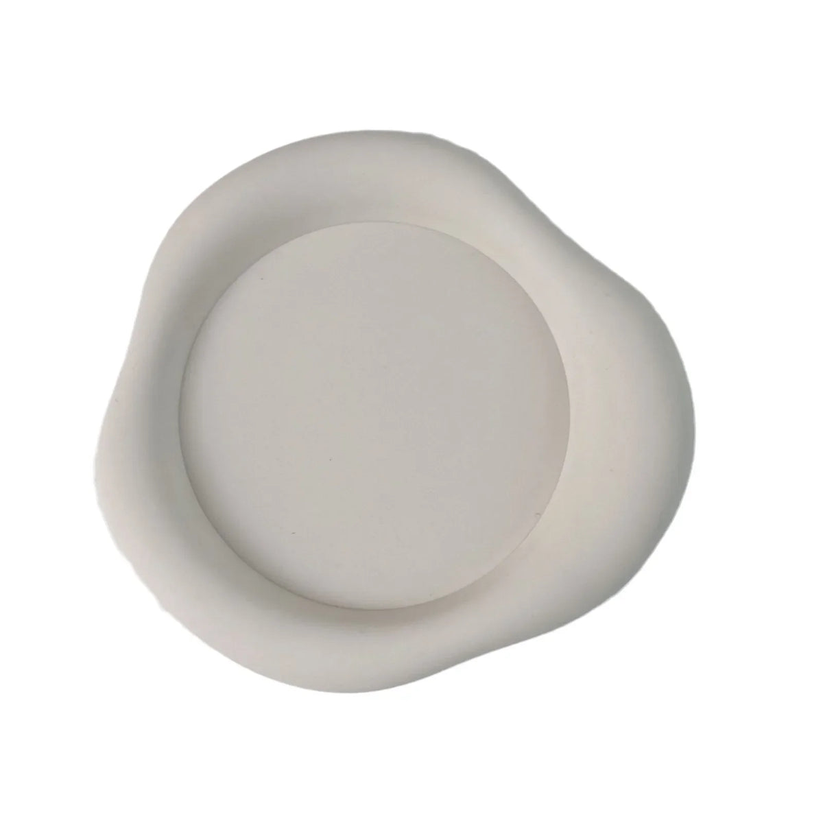 A round, matte white silicone coaster with a slightly raised rim.