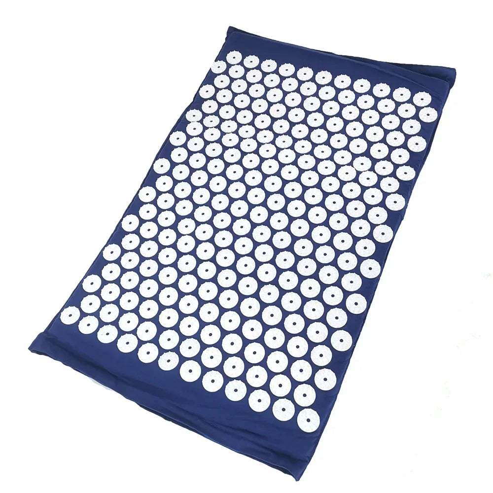 A dark blue acupressure mat with white dots, shown flat.