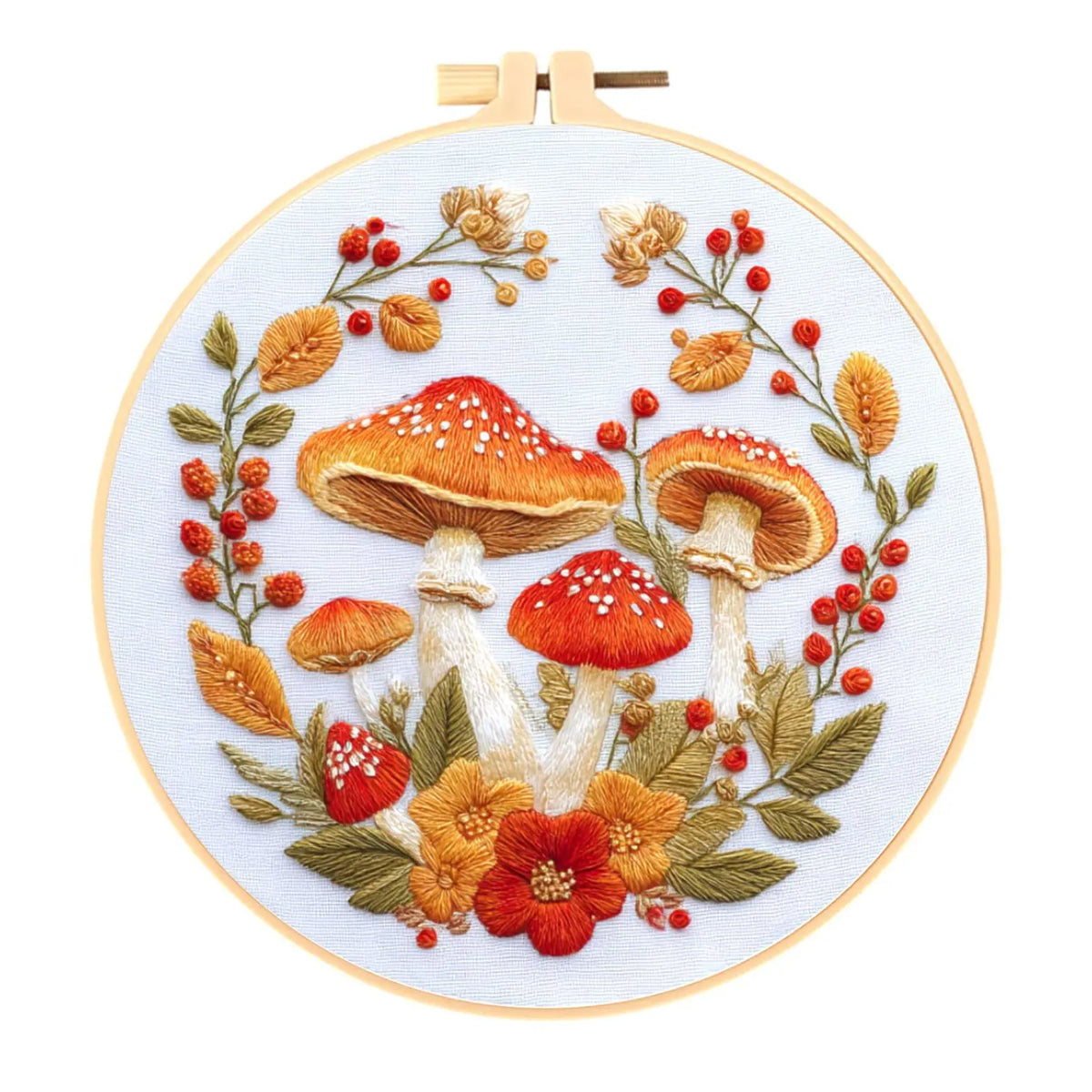 Cross stitch kit featuring an embroidered design of various mushrooms and autumn foliage.