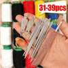 A hand holds a complete sewing needle kit with various threads and accessories, including a threader and a small knife.