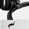 A black stroller cup holder and phone mount with a clear light bulb visible on the device.