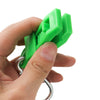 A hand is holding a bright green durable glove clip with an ergonomic grip.