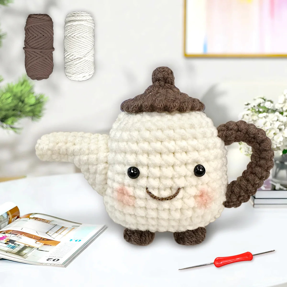 A finished crochet amigurumi of a cute animal, likely a bear or similar creature, made with brown and white yarn.