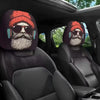 A pair of horror-themed car headrest covers featuring creepy bearded faces and sunglasses on black leather seats.