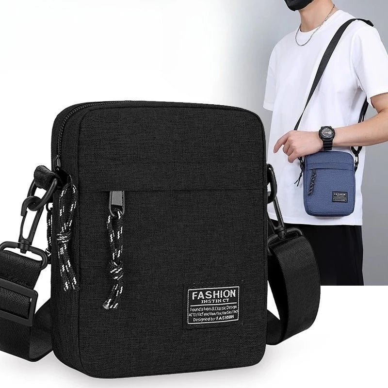 Black mini crossbody phone bag with adjustable strap worn by a person.