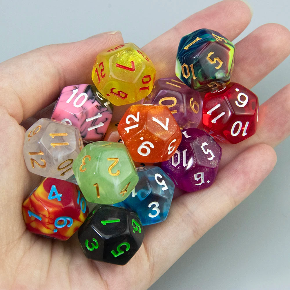 A hand holds a set of ten polyhedral dice in various colors and shapes for tabletop role-playing games