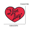 Red heart shaped embroidered patch with the text I Love Lucy