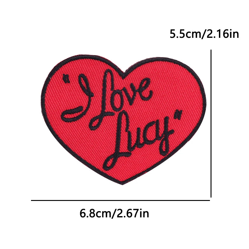 Red heart shaped embroidered patch with the text I Love Lucy